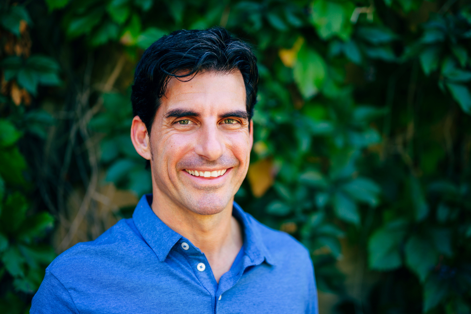 Outdoor portrait of smiling mature Spanish man